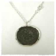Bronze roman coin in silver mount
